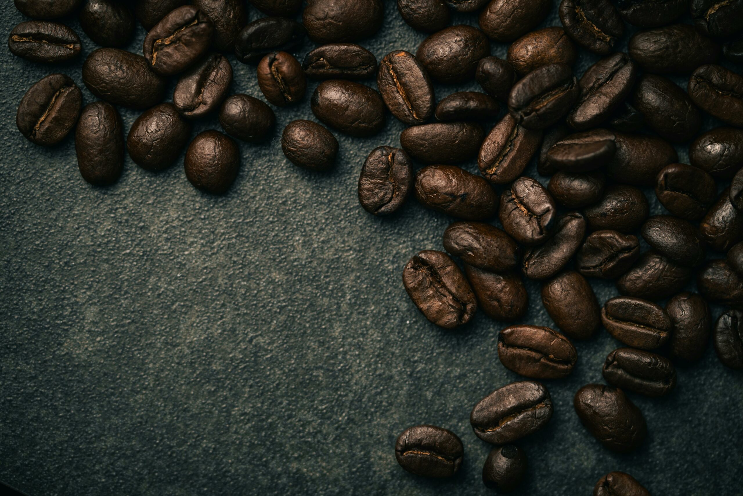A detailed close-up of roasted coffee beans, ideal for coffee lovers and cafe themes.